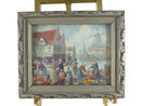 Framed painting of a market scene with people and a windmill.
