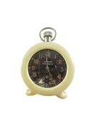 Vintage pocket watch with a cream-colored casing on a white background