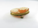 Angled view of cameo in 800 silver rope twist frame