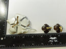 Back of flower brooch showing rollover safety catch