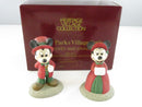 Department 56 Mickey and Minnie handpainted porcelain figurines displayed in front of the Heritage Village Collection box.