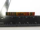 Back of WWII three-ribbon bar showing long pin stem and drop-in latch