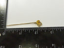 Close front view of floral stick pin with faux pearls and clear rhinestone