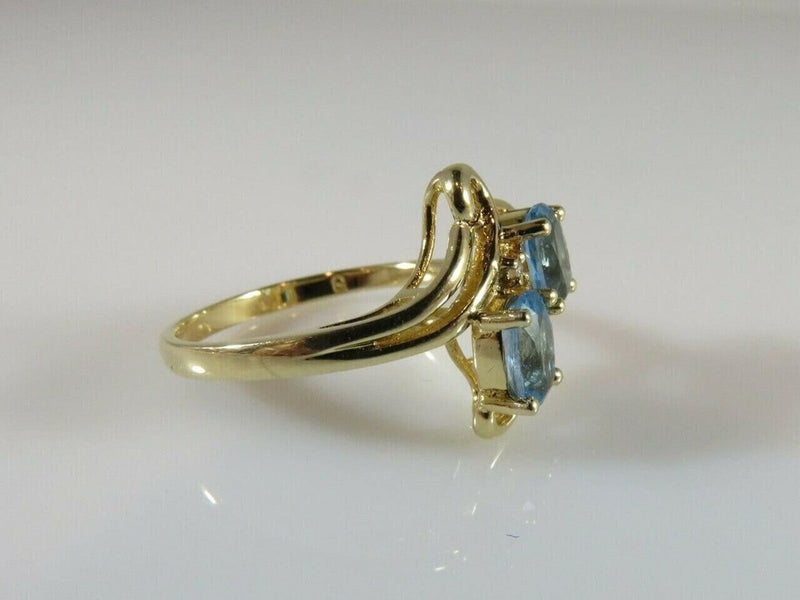 14K Yellow Gold Ring Size 6 3/4 with a Pair 6mm x 4mm Oval Cut Blue Topaz product image for Just Stuff I Sell, clear front view, neutral background, original listing photo, optimized descriptive alt text, centered composition variant 7