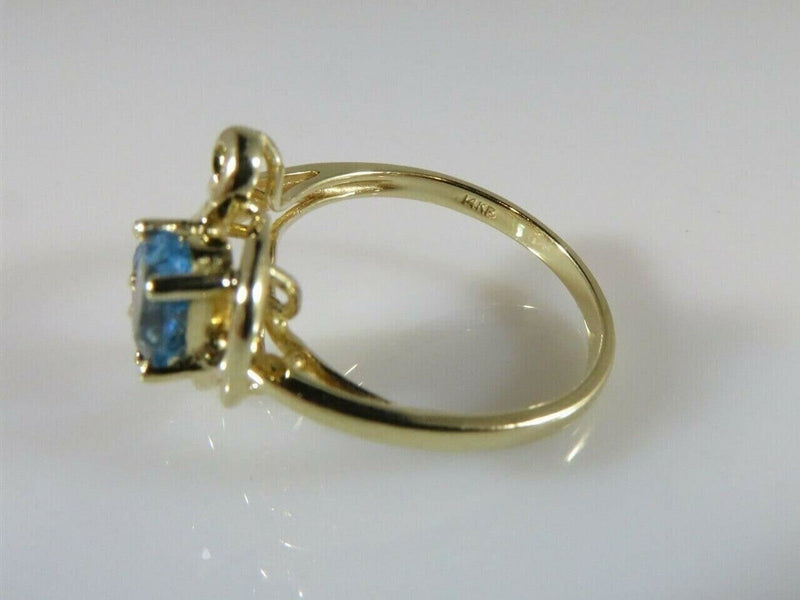 14K Yellow Gold Ring Size 6 3/4 with a Pair 6mm x 4mm Oval Cut Blue Topaz product image for Just Stuff I Sell, clear front view, neutral background, original listing photo, optimized descriptive alt text, centered composition variant 9