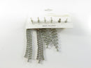 Back view of the earring card showing rhinestone dangle posts with plastic disc backs
