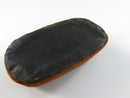 Top view of rust orange velvet oval riser with satin-lined slot