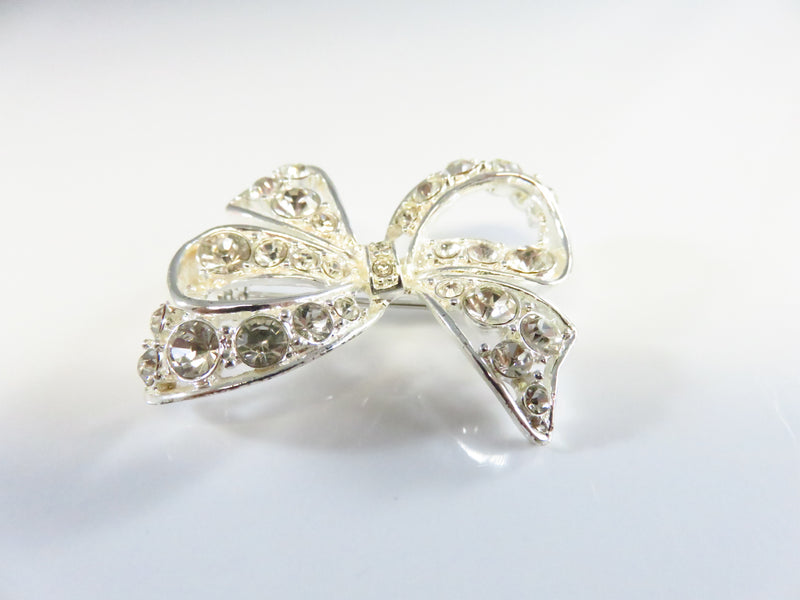 Rhinestone Bow Pin Silver Tone Bow with Safety Latch 1 1/2" x 1 1/2"