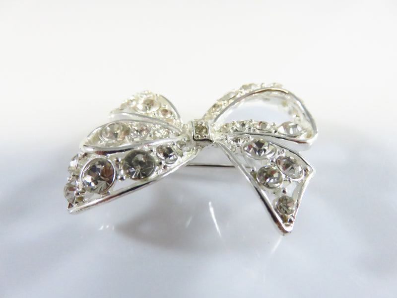 Rhinestone Bow Pin Silver Tone Bow with Safety Latch 1 1/2" x 1 1/2"