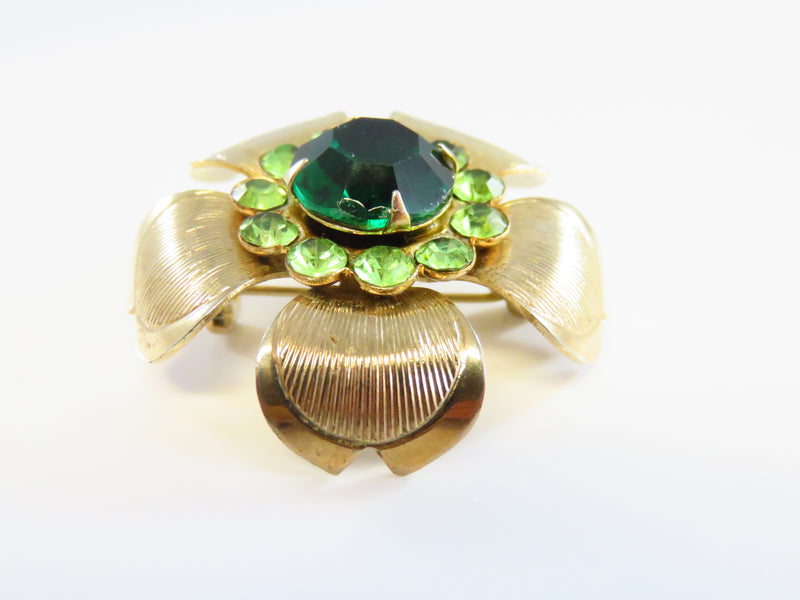 50's Style Green Rhinestone Gold Tone Flower Brooch With Recurved Petals