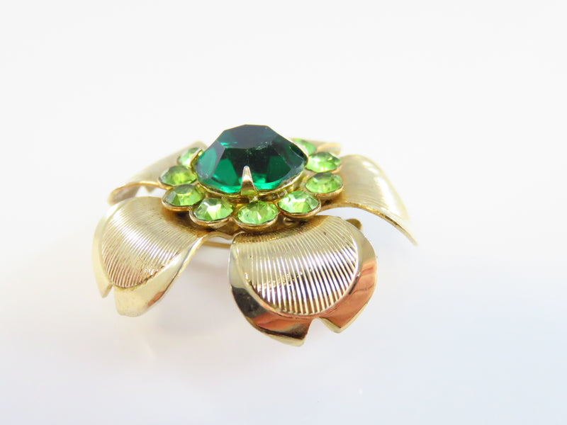 50's Style Green Rhinestone Gold Tone Flower Brooch With Recurved Petals