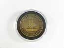 Gold and black coin with '80 Years of Nuttiness' text on a white background