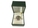 Jewelry box with a green stone ring on a white background