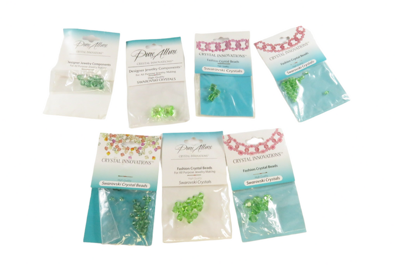 Grouping of Green Crystal Innovations Swarovski Crystals Fashion Beads New Old Stock — Peridot — front view