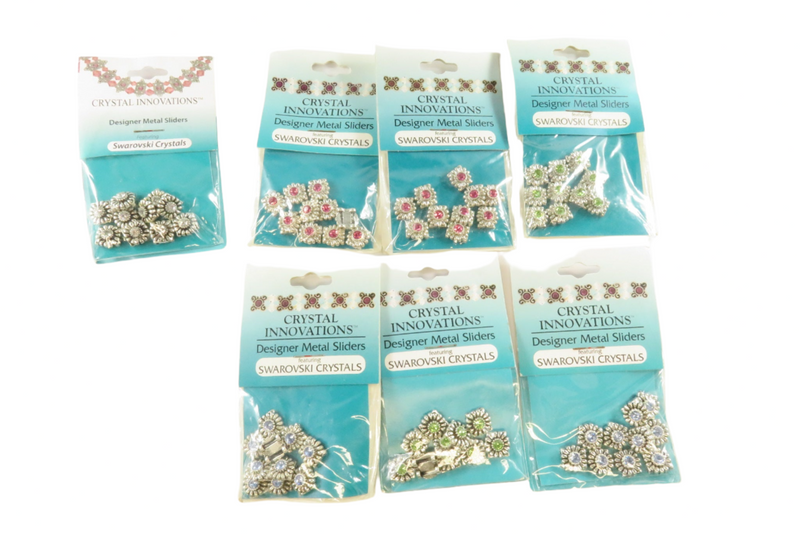 Grouping of Crystal Innovations Swarovski Crystals Designer Metal Sliders New Old Stock — front view