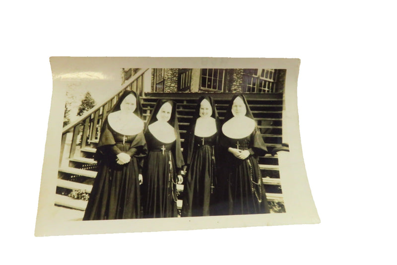 Photo of 4 Nun Standing In Front of Church