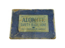 Vintage Aloxite safety blade hone box on a white background