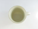 Top view of cream-colored ceramic coffee mug