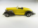 Hot Wheels Auburn 852 diecast car with yellow body and brown fenders
