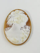 Right-facing profile cameo on natural shell