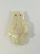 Stylized owl brooch made from natural shell