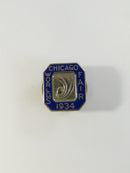 Close-up of Chicago World's Fair 1934 pin with cobalt blue enamel