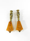 Close-up of Bakelite drawer pulls with brass hinges