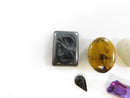 Close-up of Hematite Intaglio and other loose stones