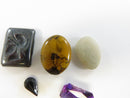 Loose Gemstone and Bead Lot with Hematite Intaglio and Synthetic Stones Purple Stone Plastic Oval Unidentified White Sto