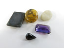Loose Gemstone and Bead Lot with Hematite Intaglio and Synthetic Stones Purple Stone Plastic Oval Unidentified White Sto