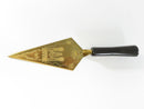 Gold-tone Masonic trowel with black handle