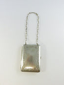 Close-up of silver-toned purse design