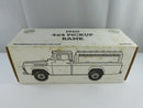 ERTL Classic Motorbooks 1960 Ford F-100 4x4 pickup bank, driver-side view showing red cab and white service body