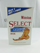 Angled front and side view of Winston Select Lights Box sealed cigarette pack showing Complimentary panel
