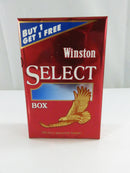 Angled front and side view of Winston Select hard pack showing Complimentary barcode label