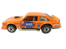 Left-side view of orange Hot Wheels Flat Out 442 die-cast stock car with blue 442 door livery, STP, Goodyear GT, Bell, and Western Wheels graphics.