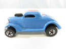 Left-side view of light blue Hot Wheels Neet Streeter customized 1936 Ford Coupe with black hood scoop and blackwall wheels