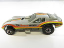 Side view of Hot Wheels Tom McEwen Mongoose Corvette Funny Car showing silver body, side livery, engine, and blackwall wheels
