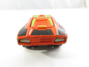 Top view of orange Lamborghini Countach with green racing tampos and number 8 hood panel