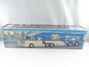 Sunoco Ultra 94 Racing Team truck and trailer left-side view with Number 94 race car in side display window