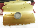 Back view of solid brass Alaska Collage ornament showing © J.P. marking and hanging cord