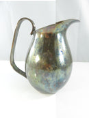 Carl F. Christensen silver plate creamer pitcher shown from the spout side with arched handle