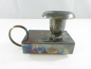 Top view of Bellini silver plate chamberstick showing the candle opening, ring handle, and matchbox sleeve
