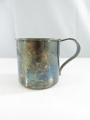 Top view of the child's baby cup showing the gold-washed interior and floral relief handle