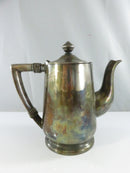 Underside of Reed & Barton coffee pot showing SILVER SOLDERED, NS777 3 1/2, and A SHERATON HOTEL markings