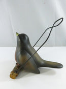Right-side view of the robin bird figurine with metal wire hanging loop and faux bark perch