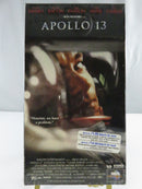 Back of factory-sealed Apollo 13 VHS slipcover showing synopsis, UPC 096898241830, MCA Universal Home Video logo, and PG rating