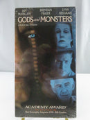 Back of factory-sealed Gods and Monsters VHS slipcover showing film stills, synopsis, awards text, and UPC 400081656989