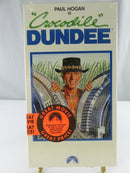 Back of factory-sealed Crocodile Dundee Paramount VHS slipcover showing synopsis, Hi-Fi Stereo panel, barcode, cast and PG-13 rating