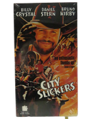 Front of factory-sealed City Slickers VHS slipcover with Billy Crystal, Daniel Stern, Bruno Kirby, and New Line Home Video logo